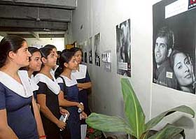 Students take a look at the pictures displayed during an exhibition on adolescent drug de-addiction at Government College in Sector 46, Chandigarh