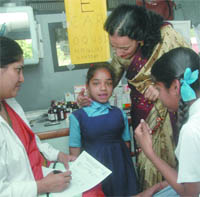 A health check of State Bank of India, Delhi Circle, adopted girl students, being held in the Capital on Wednesday.