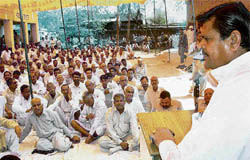 BSP leader Arjun Singh addresses a mahapanchayat to discuss the Buria-Khadri-Deodhar road that requires repairs.