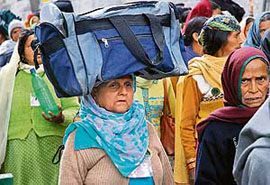 Women belonging to the Himachal Pradesh Single Womens Association walk towards the Vidhan Sabha to meet the chief minister in Shimla after completing a three-day journey of 40 km from Dhami, on Thursday.