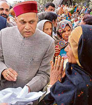 Chief Minister Prem Kumar Dhumal is all ears to a single woman outside the Vidhan Sabha in Shimla on Thursday.