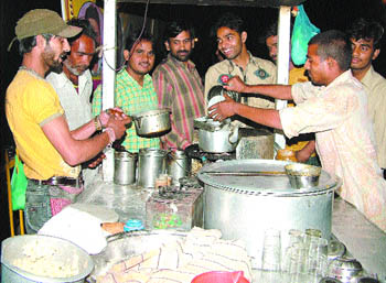 Ashoki serving tea to his customers at Milap Chowk in Jalandhar.