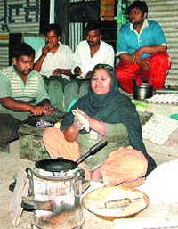 Naseema aunty making paranthas at her stall at Jyoti Chowk in Jalandhar. 