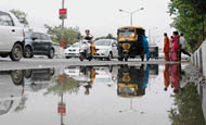 Roads were flooded with water after showers lashed the city on Thursday. 