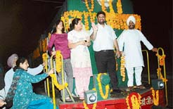UT mayor Pradeep Chhabra waves after flagging off the first Chandigarh-Jaipur train at the railway station