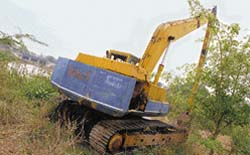 A heavy machine purchased by the UT engineering department for desilting lies abandoned near the rowing channel at Sukhna Lake