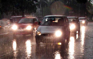 Out of season rain in the Capital on Friday afternoon added to traffic problems. Vehicles moved with lights on as it was dark before evening. 