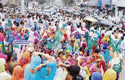 INLD activists block traffic in protest against price rise in Hisar