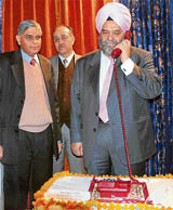 Chief executive officer of Prasar Bharati B.S. Lali launches news-on-phone service in Shimla on Friday.