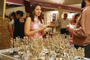 A woman busy during the three-day exhibition at a hotel in Ludhiana on Friday. 