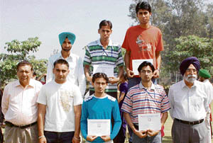 Chairman of DIMT, Sukhpal Singh, and Dr R.K. Lekhi, director, DIMT, along with the prize winners during the sports meet at DIMT in Doraha on Friday. 