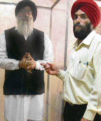 Parwinder Singh with the model of Parkash Singh Badal in Mohali.