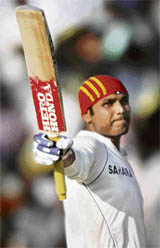 Virender Sehwag acknowledges the greetings of the crowd after his treble ton at Chennai