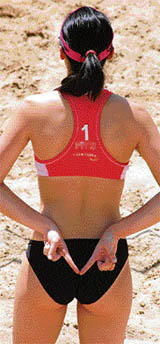 A Hong Kong beach volleyball player signals to her partner during a match at the Asian Beach Volleyball Championship in Hyderabad on Friday.