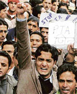 PTA teachers raise slogans during a protest rally in Shimla on Saturday.