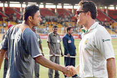 Anil Kumble congratulates South African skipper Graeme Smith after the latter won the Test against India with an innings and 90 runs to spare at the Sardar Patel Stadium in Ahmedabad on Saturday.