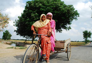 Women enjoy a ride in Gilpatti village near Bathinda. 