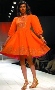 A model displays a creation of designer Preeti Chandra during a fashion show at Delhi Race Club in the Capital on Sunday. 