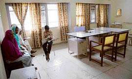 Patients wait for doctors at the general hospital in Kaithal.