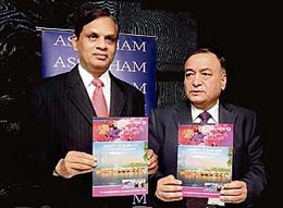 Assocham president Venugopal N Dhoot (L) releases a report of Jammu and Kashmir striving for industrial revolution in Jammu on Sunday.