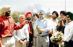 Dhanbir Singh Bains, surrounded by supporters, celebrates his victory as the new president of the Chandigarh Golf Club in Chandigarh.
