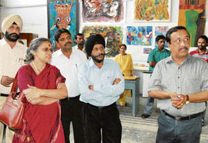 Archana Shastri (left), along with other faculty members, takes a round of Government College of Art after joining as the principal in Chandigarh on Monday.