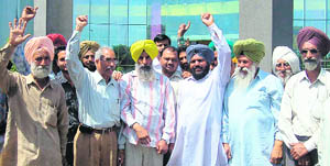 People of Matour village protest in front of the MC Bhawan in Mohali on Monday.