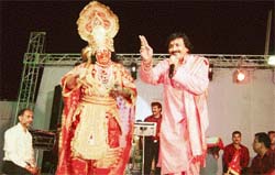 Singer Rajan Chanchal recites a bhajan during a jagran at Ahmedgarh