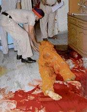 The police examines the body of the constables wife.