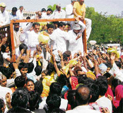A crowd clamours for rations distributed by activists of the Haryana Janhit Congress (BL) in protest against price rise in Hisar on Tuesday.