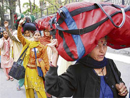 Single women walk towards the Vidhan Sabha to meet Chief Minister P.K. Dhumal after completing a three-day journey from Dhami to Shimla recently.
