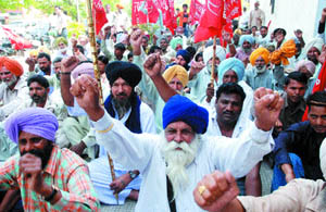 Farmers protest in Jalandhar on Tuesday.