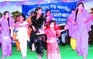 Students of Government Primary School, Daroki Khurd, perform during the annual prize distribution function on Tuesday. 