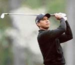 Tiger Woods of the USA watches his shot on the 12th tee during the second day of the practice prior to the start of the 2008 Masters Tournament in Augusta National Golf Club in Augusta, Georgia