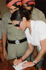 Preity Zinta gives autographs to cops at PCA Stadium, Mohali, on Wednesday.