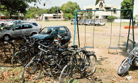 Vehicles, including cars, two-wheelers and cycles, parked inside a park in a residential area in Sector 35, Chandigarh, on Wednesday.