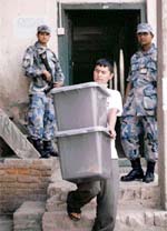 An election official collects ballot box from an election office in Kathmandu on Wednesday.