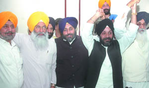 Manjeet SIngh GK, who merged his party into the Shiromani Akali Dal, with Chief Minister of Punjab, Parkash SIngh Badal, his son Sukhbir SIngh Badal, president of Shiromani Akali Dal (Badal), SS Dhindsa, Avtar SIngh Hit during a press conference in the Capital on Thursday. 