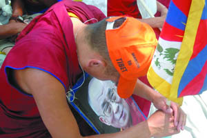 A Tibetan activist holds a photo of the Dalai Lama during a rally against the Chinese authorities, at Jantar Mantar in the Capital on Thursday.The rally was organised by the Tibetan Solidarity Committee. 