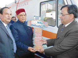 Chief Minister Prem Kumar Dhumal hands over the symbolic key of a critical care superspeciality ambulance to IGMC principal S.K. Kashyap in Shimla on Thursday.