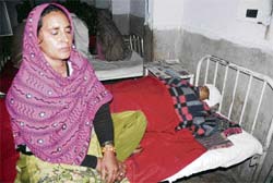 Noor Zehan lies in a hospital bed