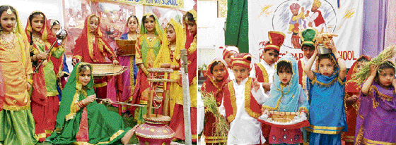 Students of Rising Stars Playway School and (right) Kiddies Paradise celebrate Baisakhi in their schools in Ludhiana on Thursday.