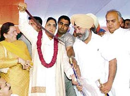 Punjab Congress chief Rajinder Kaur Bhattal holds a sword at jan chetna lalkar rally in Amritsar on Thursday.
