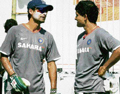 Mohammad Kaif in conversation with Sourav Ganguly during a training session in Kanpur on Thursday.