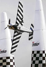 Russian pilot Sergy Rakhmanin maneuvers his plane through obstacles during the first round of Red Bull Air Race World Series in Abu Dhabi on Thursday. Twelve pilots are competing in the two-day event. 
