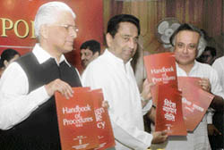 Union commerce and industry minister Kamal Nath releases the annual supplement to Foreign Trade Policy with ministers of state Ashwani Kumar (L) and Jairam Ramesh (R) in New Delhi