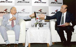 Hari Shankar Singhania (L), chairman, JK Tyre & Industries, with R.P. Sighania, vice-chairman and managing director of the company addressing mediapersons during a press conference to announce the acquisition of Mexican Tyre company Tornel in New Delhi