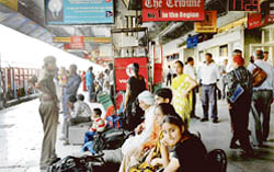 Passengers wait for trains at the Chandigarh railway station. Following derailment of a goods trains at Ambala, trains were running behind schedule
