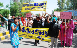 Members of the Computer Teachers Union press for their demands in Bathinda on Saturday. 