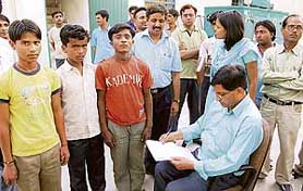 Children being counselled by officials of the education department at a wine factory in 
